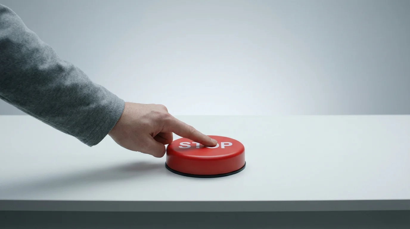 Person pressing a stop button symbolising GamStop self-exclusion